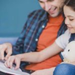 Child reading with Dad