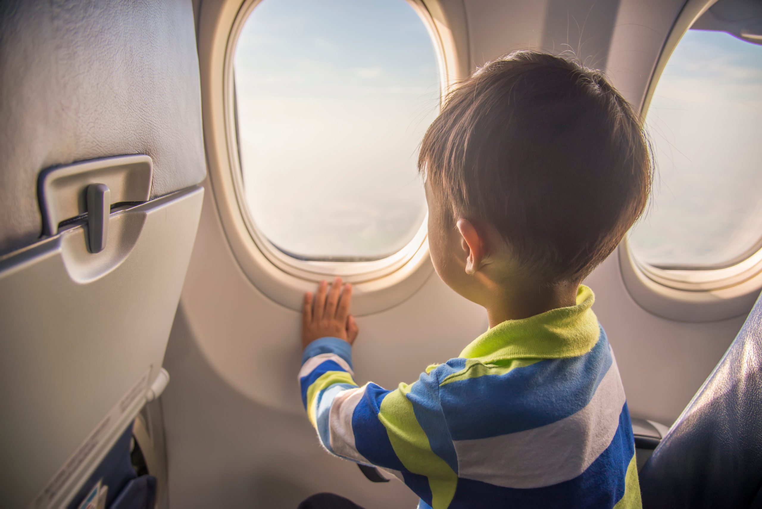 2026 Spring Break Travel Hacks boy on plane
