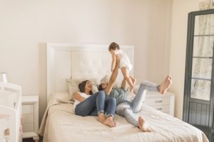 family in bed with kids - no alone time