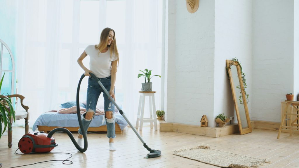 woman cleaning spring cleaning motivation hacks