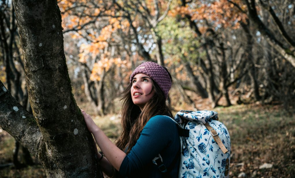 outdoorsy woman in the woods outdoor capsule wardrobe