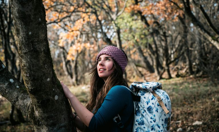 outdoorsy woman in the woods outdoor capsule wardrobe