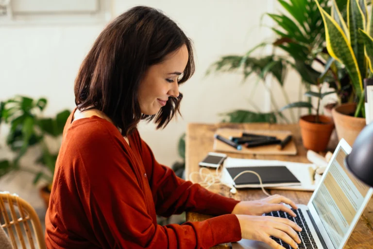woman happy on computer