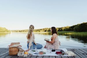 woman having a picnic picnic essentials