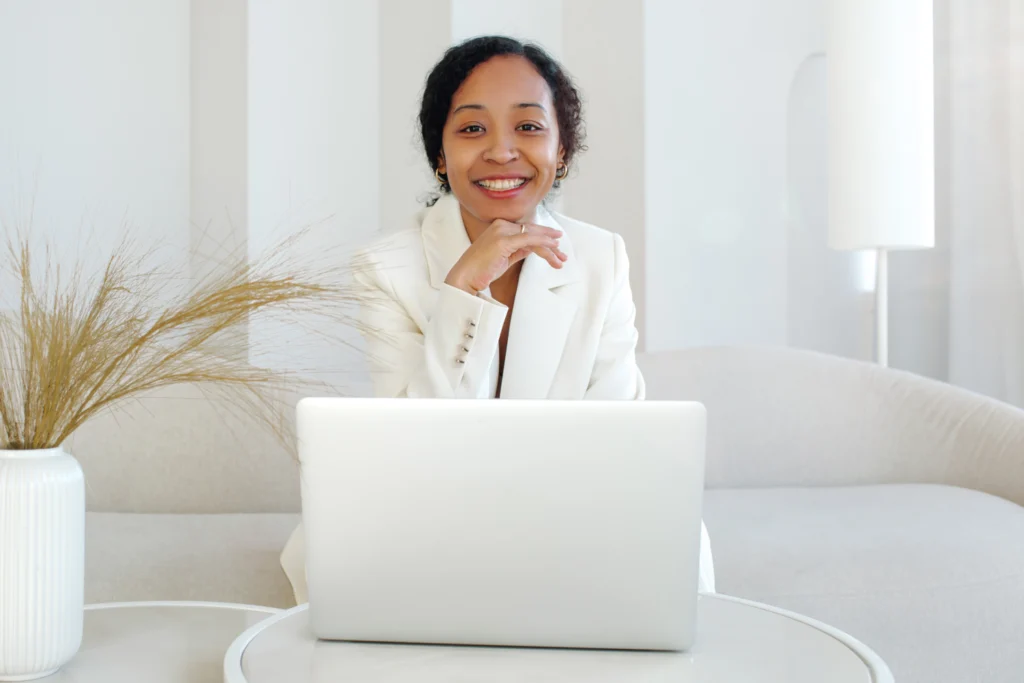 woman on laptop best scheduling app for small business 