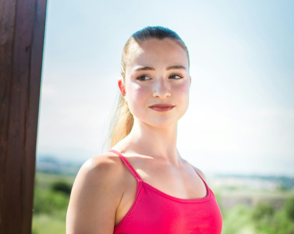 woman with ponytail working out outside
