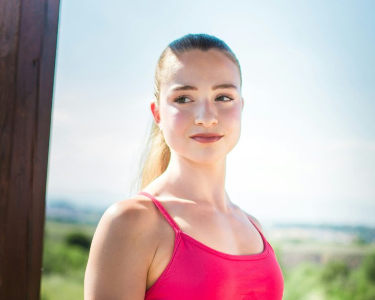 woman with ponytail working out outside