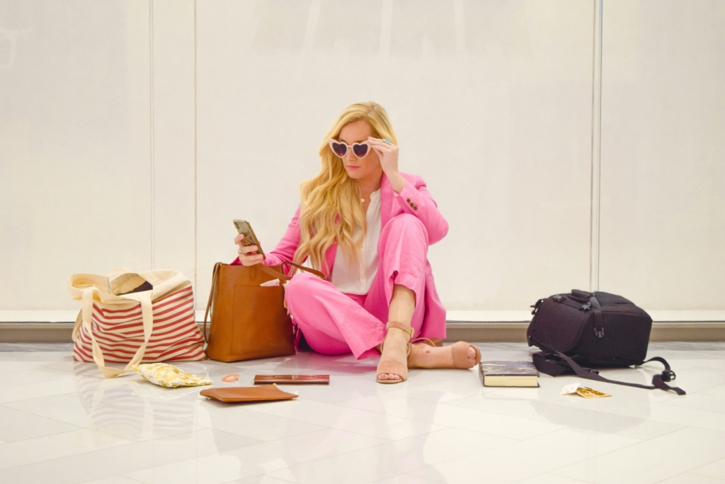 woman at airport cruise packing list first time woman packing suitcase vacation