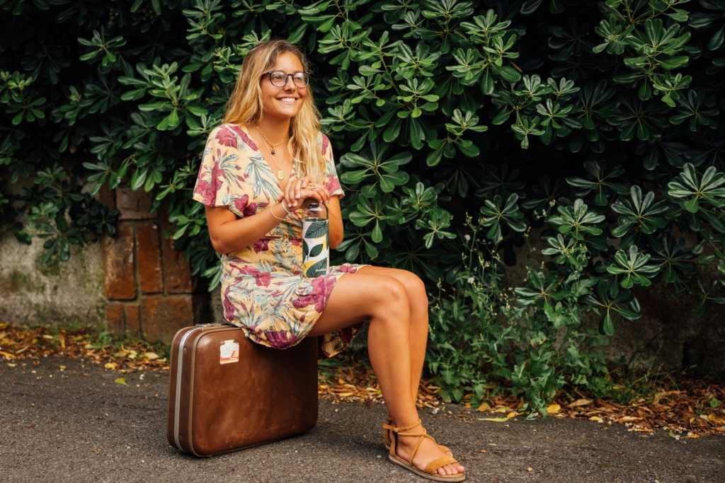 Cruise Packing List for First-Time Cruisers woman suitcase traveling vacation