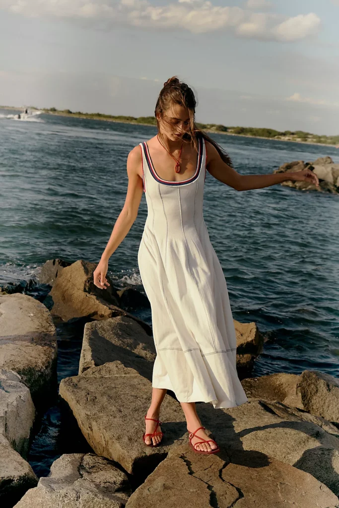 Woman in white dress by water Trendy 4th of July Outfits