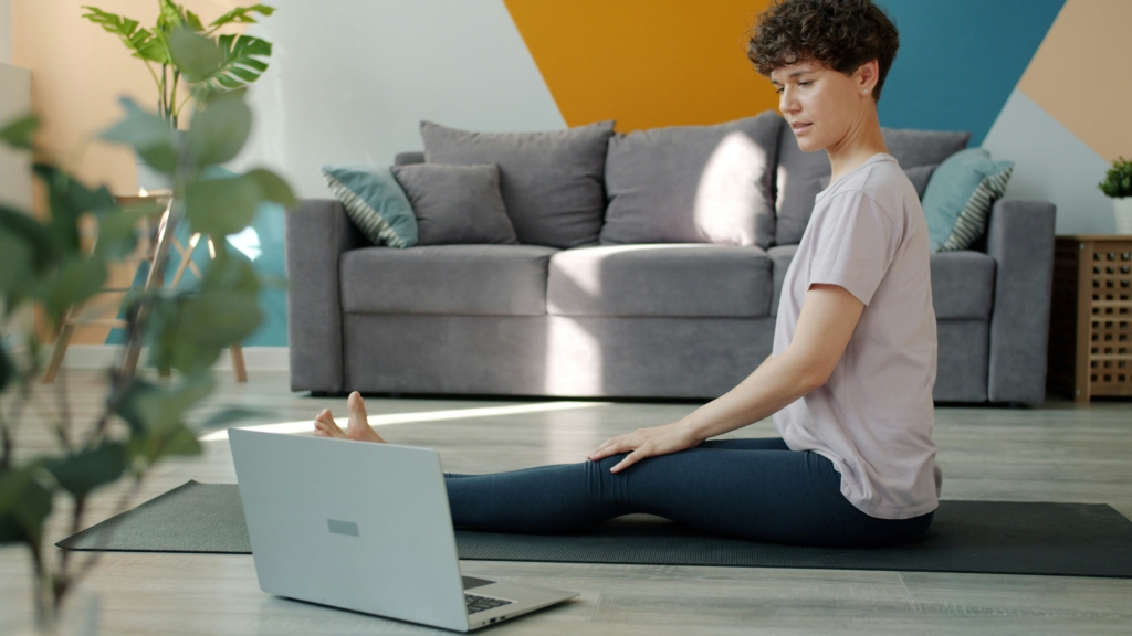 woman working out exercising at home fitness routine while traveling