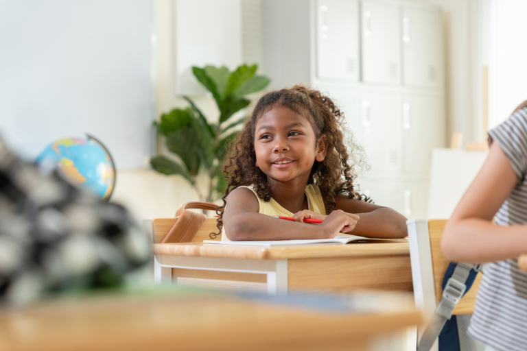 back to school outfits for girls Happy young girl student listening in classroom during lesson, Portrait of smiling school girl studying at desk in modern classroom, Education concepts with diverse student in school