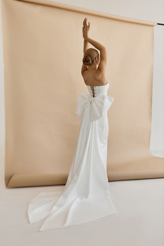 Satin Bridal Gown: Off-Shoulder Wedding Dress with Big Bow wedding dress trends 2026