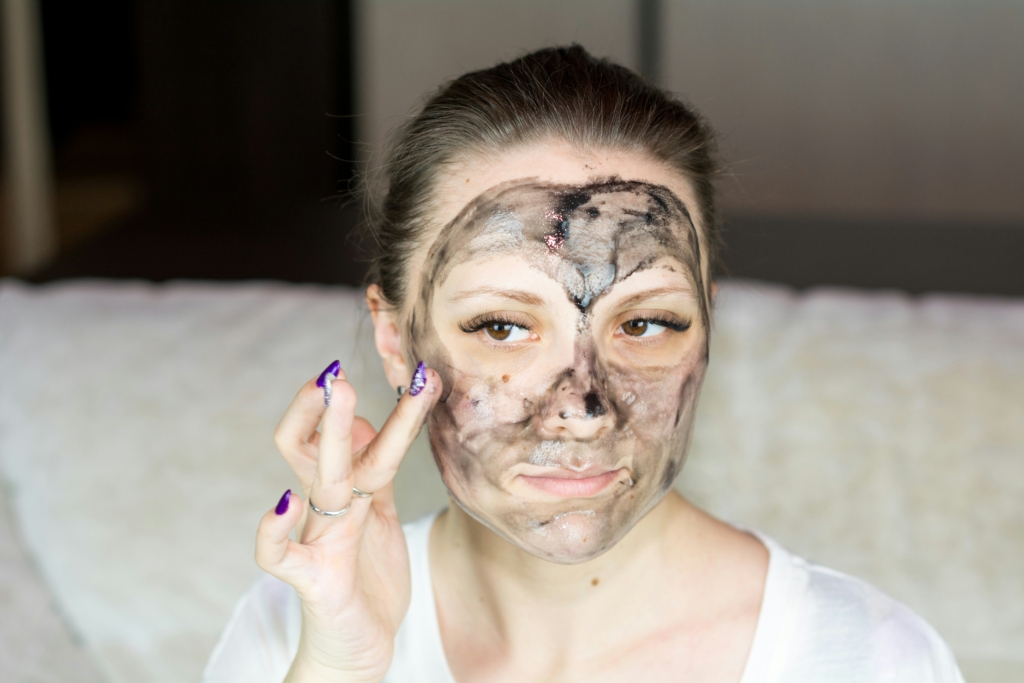 woman exfoliating her face Skincare Routine for Women in Their 30s