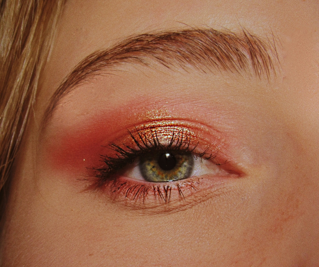 woman wearing pink eyeshadow makeup fall beauty trends 2026