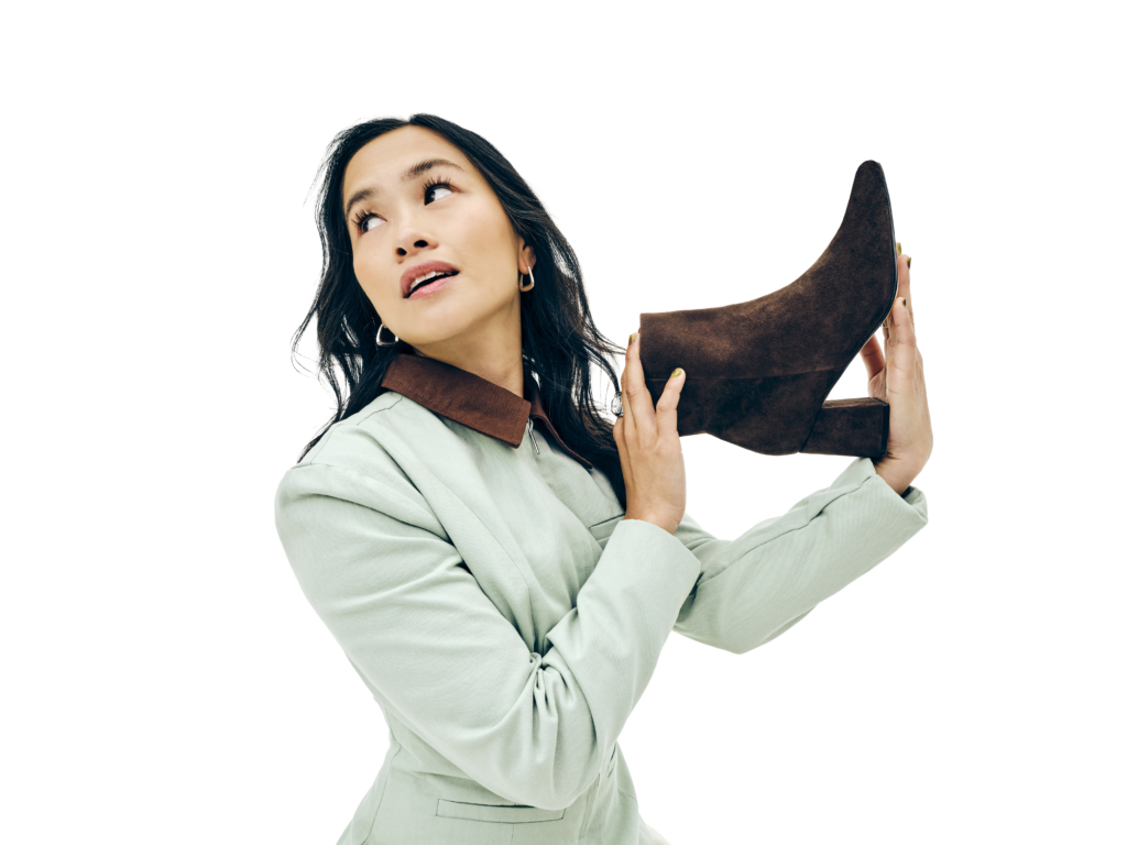 Woman holding a stylish high heel Fall Shoes Trends
