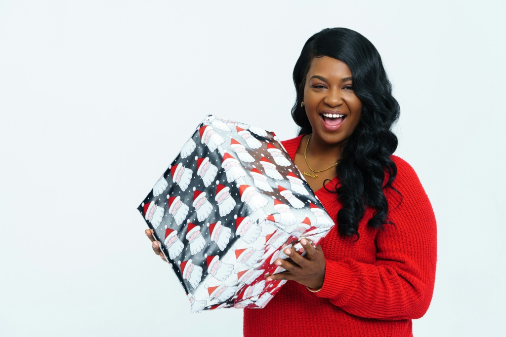 woman holding a christmas present