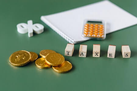 Gold Coins on Green Surface - tax preparation tools
