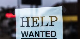 Help wanted sign on glass - Job seekers near me