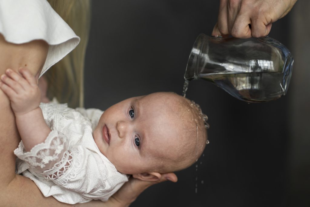 Side view baby baptism scene - What to wear to a baptism as a guest