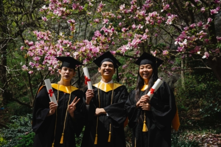 People in Black Academic Gown Standing Near Purple Flower Tree - how to recruit college students