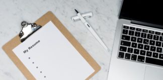 White Printer Paper Beside Silver Laptop Computer - free resume search for employers