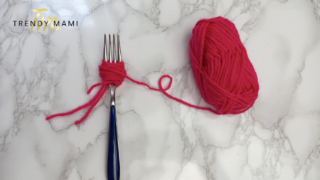 Yarn around fork - how to make pom poms
