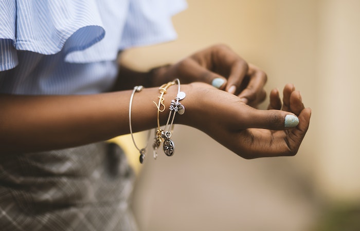 elective Focus Photography of Person Wearing Three Bangles - jewelry holiday gift guide