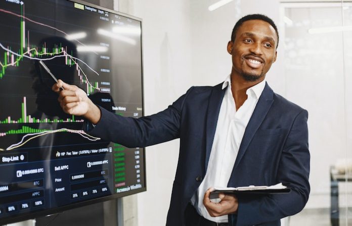 Man holding a business presentation - tech sales jobs