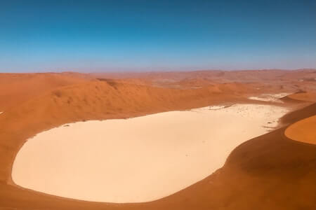 Brown Sand Under Blue Sky - warm places to visit in December