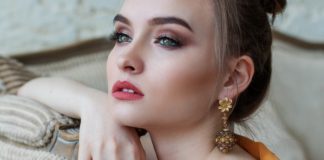 Woman Taking Selfie - winter makeup must haves