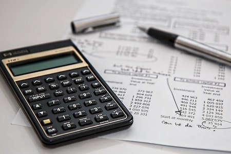 Black Calculator Near Ballpoint Pen on White Printed Paper - entry level accounting jobs