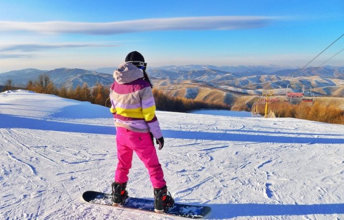 Person Snowboarding on Field - ski outfits for women