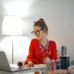 Woman in Red Long Sleeve Shirt Looking At Her LAptop - remote nonprofit jobs