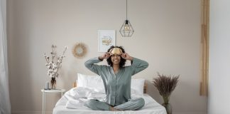 Woman in Pajamas Sitting on Bed - satin pajama set for women