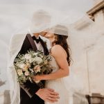 Man And Woman Kissing - inviting coworkers to wedding