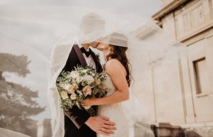 Man And Woman Kissing - inviting coworkers to wedding