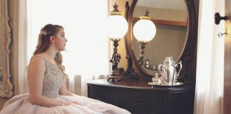 Woman Wearing Gown Looking at Mirror - spring formal dresses