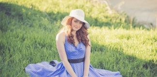 Portrait of a Smiling Young Woman in Grass - cute spring midi dresses