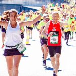 Female and Male Runners on a Marathon - best running accesories