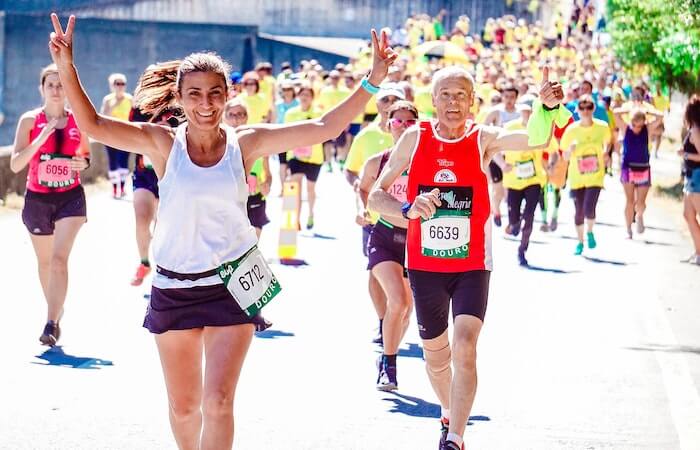 Female and Male Runners on a Marathon - best running accesories