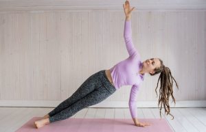 Woman In Pink Long Sleeve Shirt And Gray Leggings Doing Yoga - pilates classes for beginners