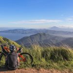 man Sitting Beside Bicycle - outdoor gifts for Father's Day