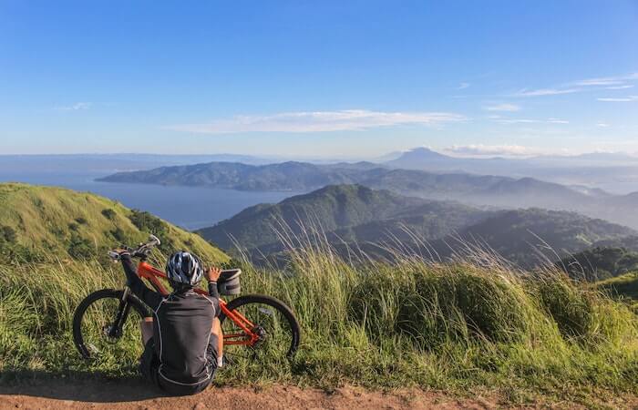 man Sitting Beside Bicycle - outdoor gifts for Father's Day