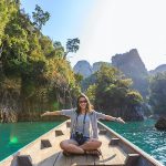 Photo of Woman Sitting on Boat Spreading Her Arms - summer vacation packages