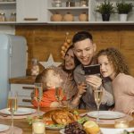 A Happy Family Bonding Time Sitting on a Dining Table - fathers day dinner ideas