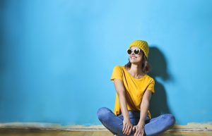 Woman in Yellow Shirt Sitting on Brown Wooden Floor - cute summer tops for women