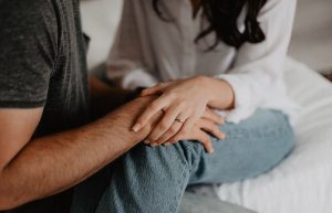 Woman Holding Man's Hand - engagement photo outfits