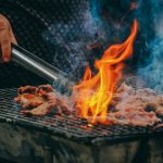 Close-Up Photo of Man Cooking Meat