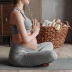 A Pregnant Woman Wearing Gray Tank Top Meditating - maternity sweatpants